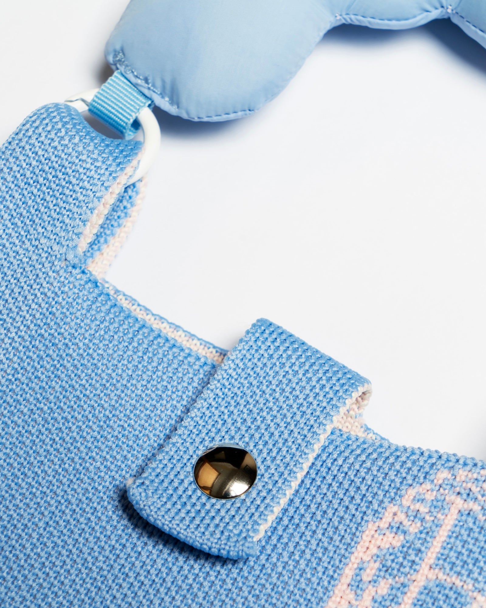 A close up view of Knitted Phone Bag