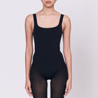 A woman wearing a black shapewear