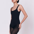 A woman wearing a black shapewear
