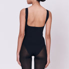 A woman wearing a black shapewear