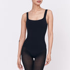 A woman wearing a black shapewear