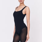 A woman wearing a black shapewear