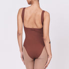 A woman wearing a teddy shapewear