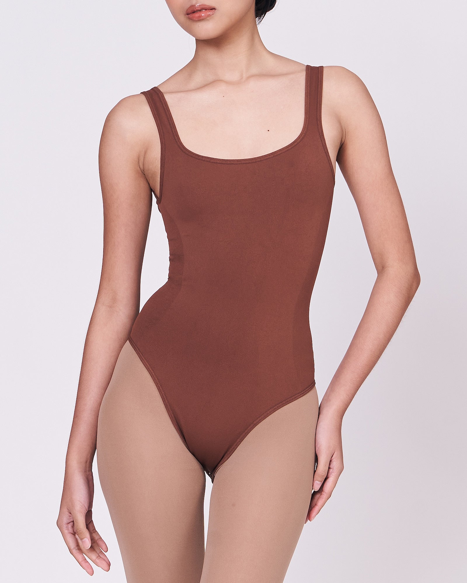 A woman wearing a teddy shapewear