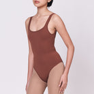 A woman wearing a teddy shapewear