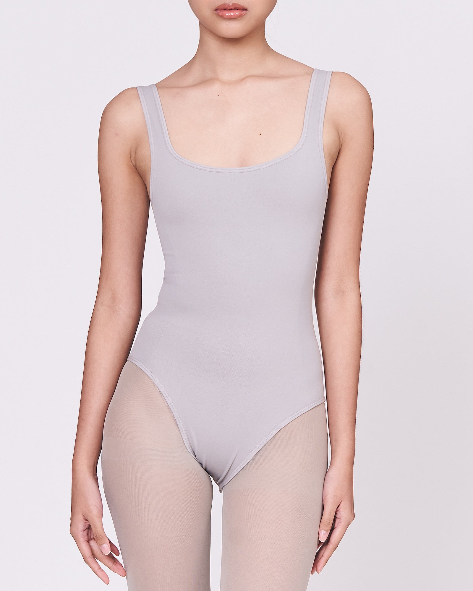 A woman wearing a stone shapewear