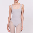 A woman wearing a stone shapewear