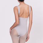 A woman wearing a stone shapewear