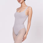 A woman wearing a stone shapewear