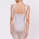 A woman wearing a stone shapewear