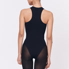 A woman wearing a black shapewear