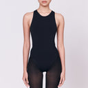 A woman wearing a black shapewear