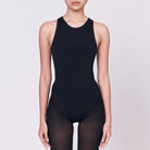 A woman wearing a black shapewear