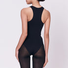 A woman wearing a black shapewear