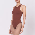 A woman wearing a teddy shapewear