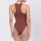 A woman wearing a teddy shapewear