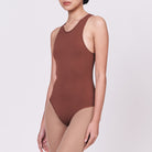 A woman wearing a teddy shapewear