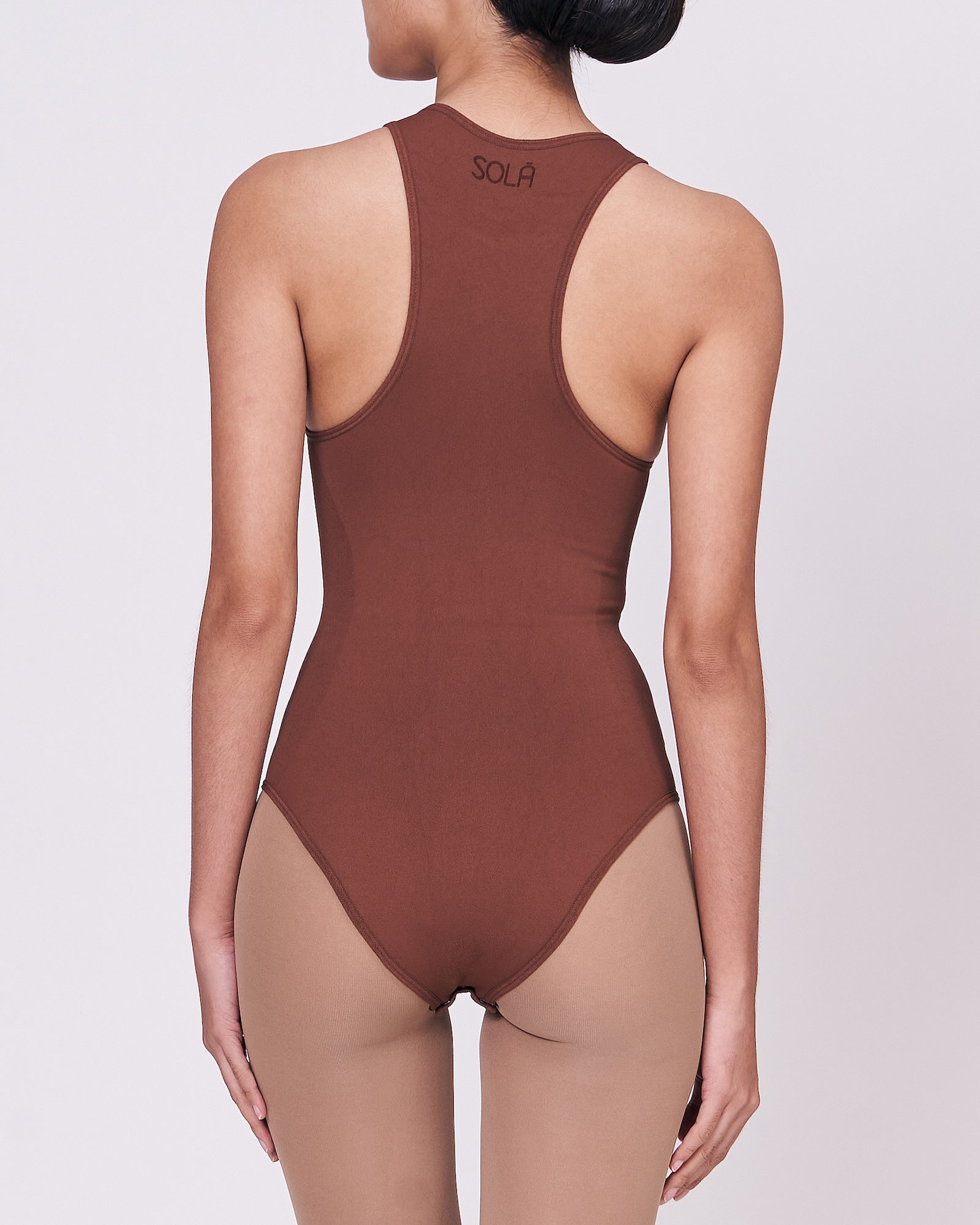 A woman wearing a teddy shapewear