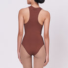 A woman wearing a teddy shapewear