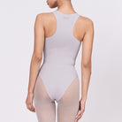 A woman wearing a stone shapewear