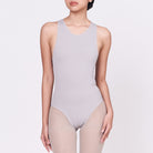 A woman wearing a stone shapewear