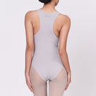 A woman wearing a stone shapewear