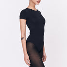 A woman wearing a black shapewear
