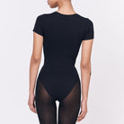 A woman wearing a black shapewear