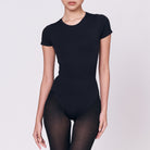 A woman wearing a black shapewear