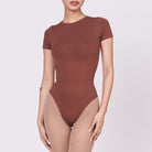 A woman wearing a teddy shapewear