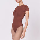 A woman wearing a teddy shapewear