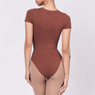 A woman wearing a teddy shapewear