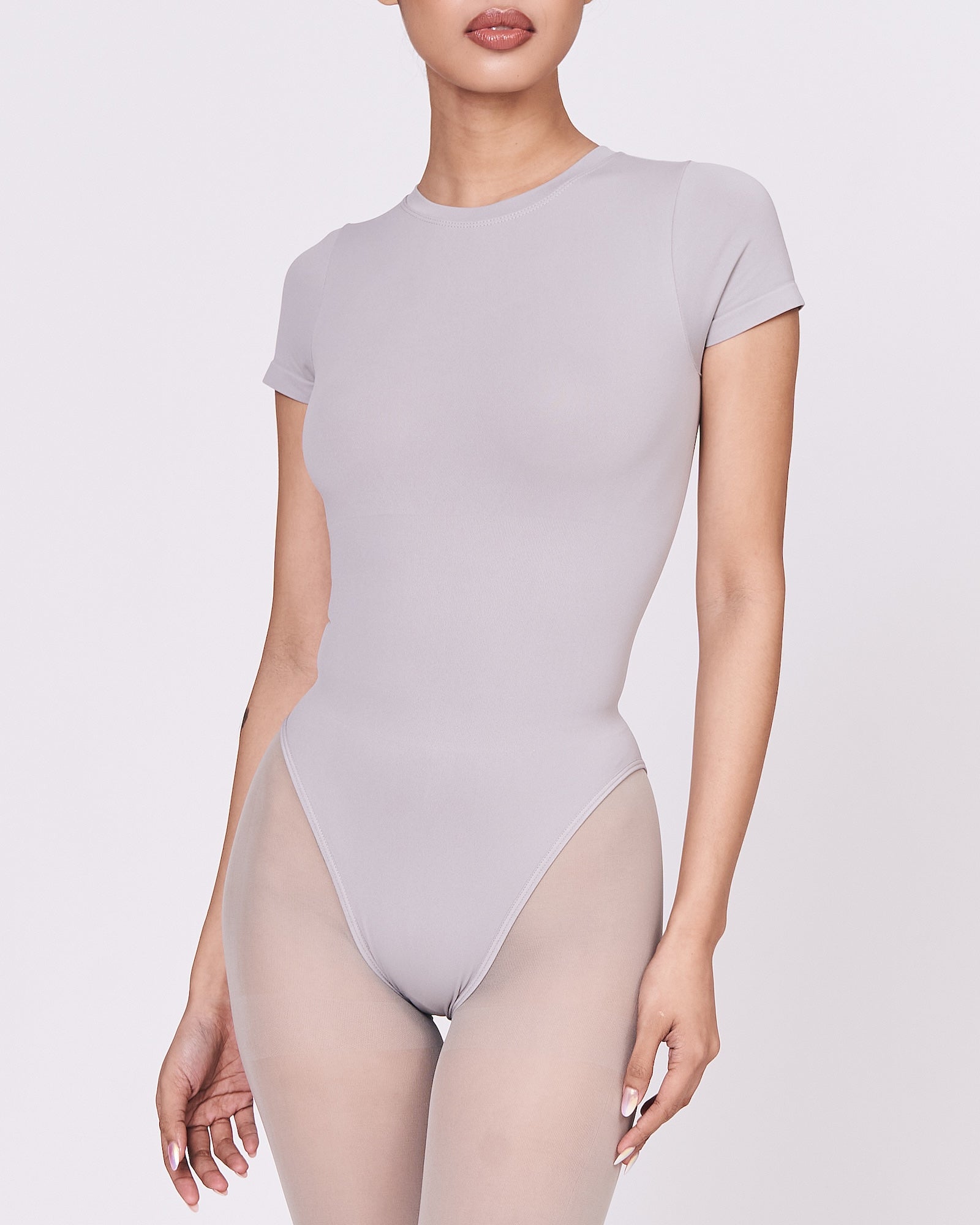 A woman wearing a stone shapewear