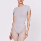 A woman wearing a stone shapewear