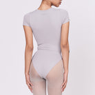 A woman wearing a stone shapewear