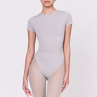 A woman wearing a stone shapewear