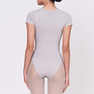 A woman wearing a stone shapewear