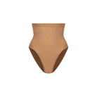 Tan high-waisted underwear on a white background
