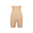 Beige shapewear shorts on a white background