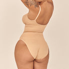 Beige swimsuit on a beige background