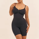 Black bodysuit worn by a model on a beige background