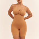 Woman wearing a beige shapewear bodysuit against a beige background