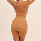 Brown bodysuit on a beige background