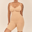 Beige shapewear bodysuit worn by a model on a beige background