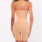 Beige strapless bodysuit on a white background